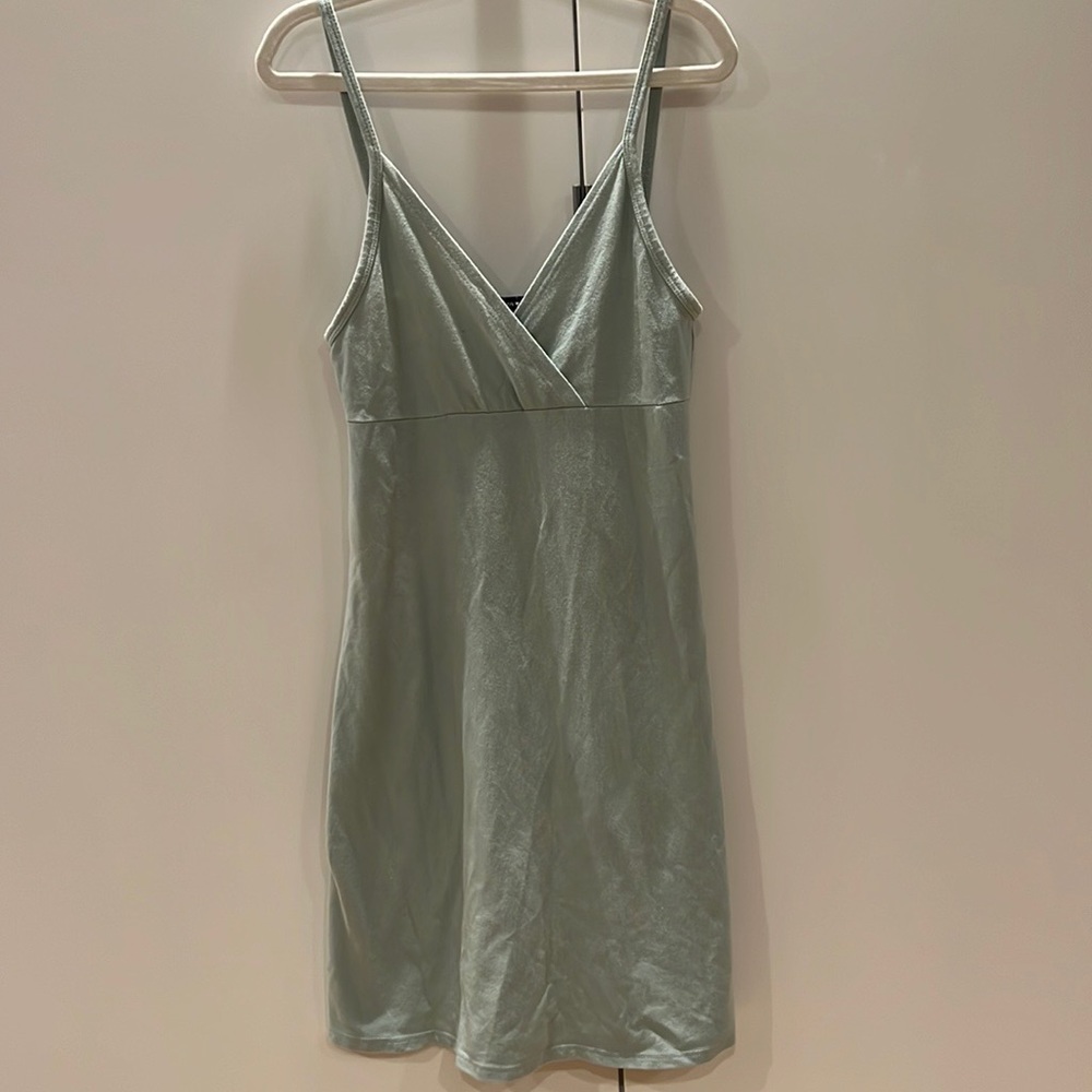 light green thin dress with crossed cut down the middle